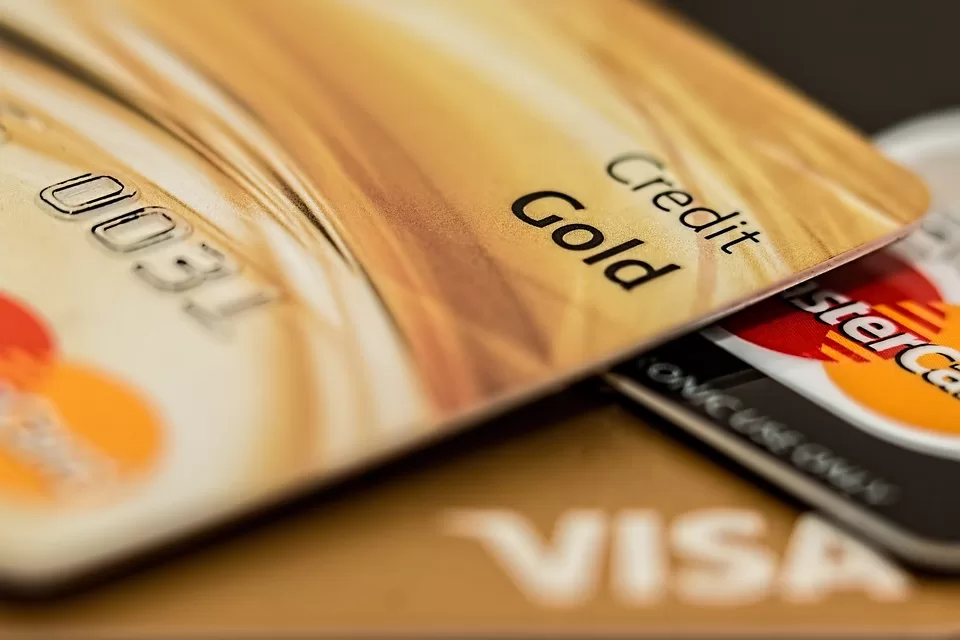 "Person using a credit card responsibly, following smart credit card usage tips for financial well-being